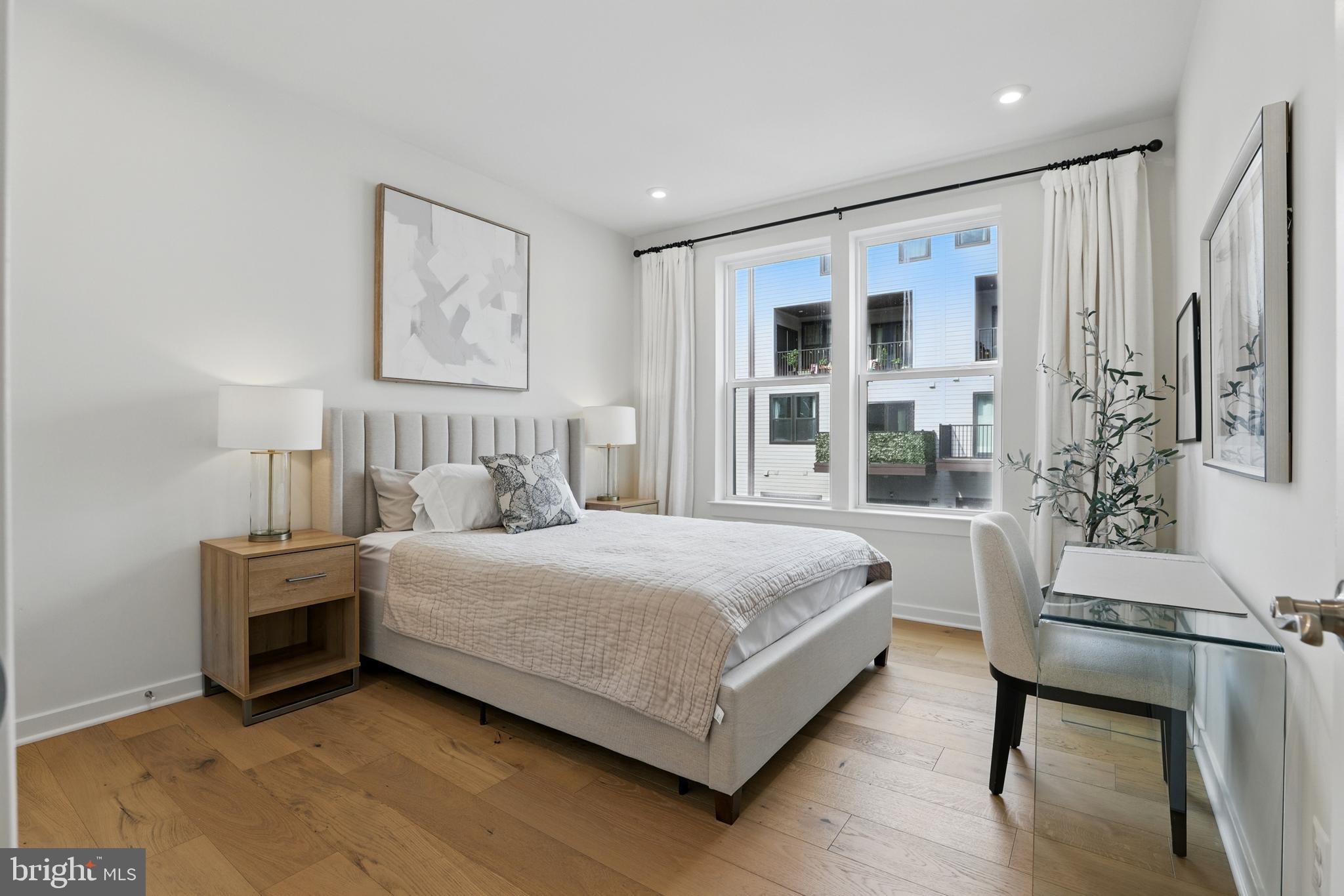 4140 Legato Road, Unit 47 Fairfax, VA 22033 - Photo 17 of 23 a bedroom with a large bed and a window