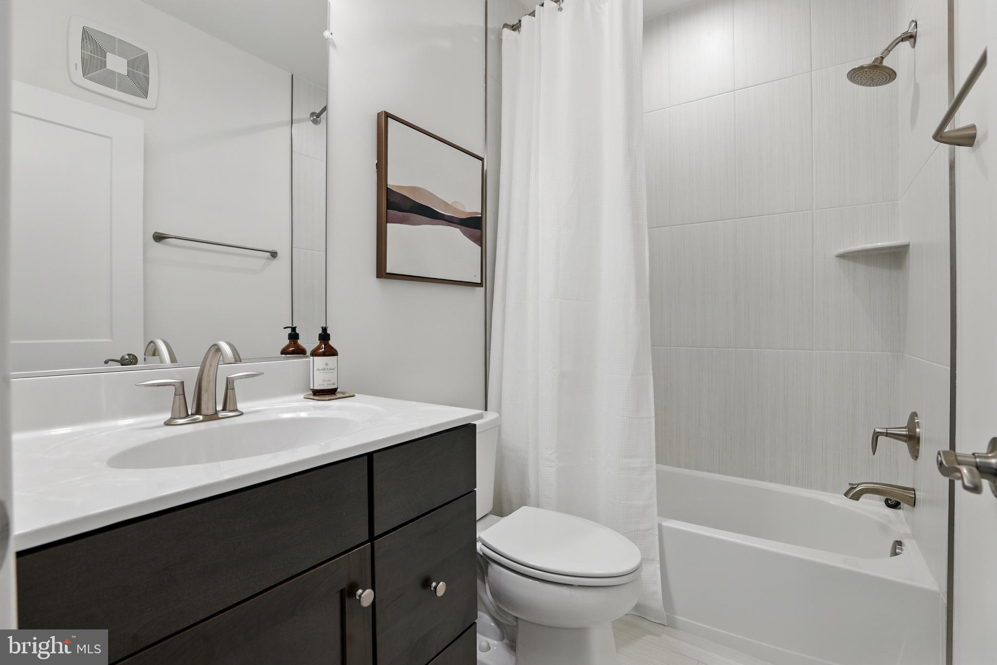 4140 Legato Road, Unit 47 Fairfax, VA 22033 - Photo 18 of 23 a bathroom with a sink toilet and shower