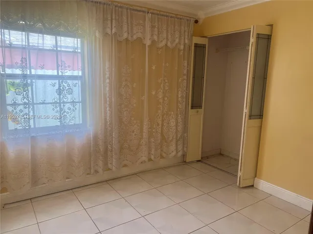 a view of an empty room with window