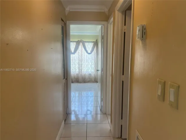 a view of a bathroom from a hallway