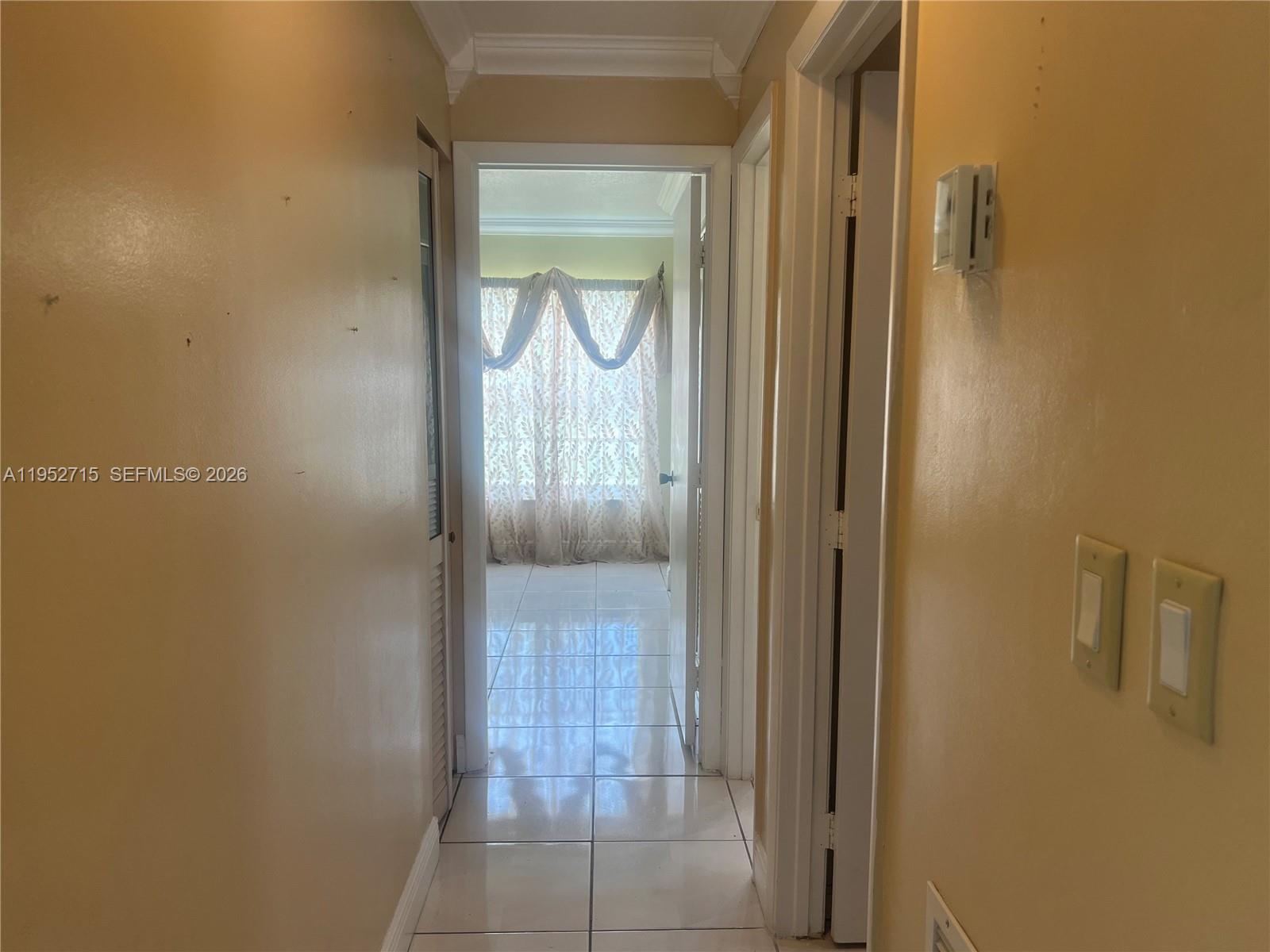 5827 Northwest 197th Terrace Hialeah, FL 33015 - Photo 18 of 30 a view of a bathroom from a hallway