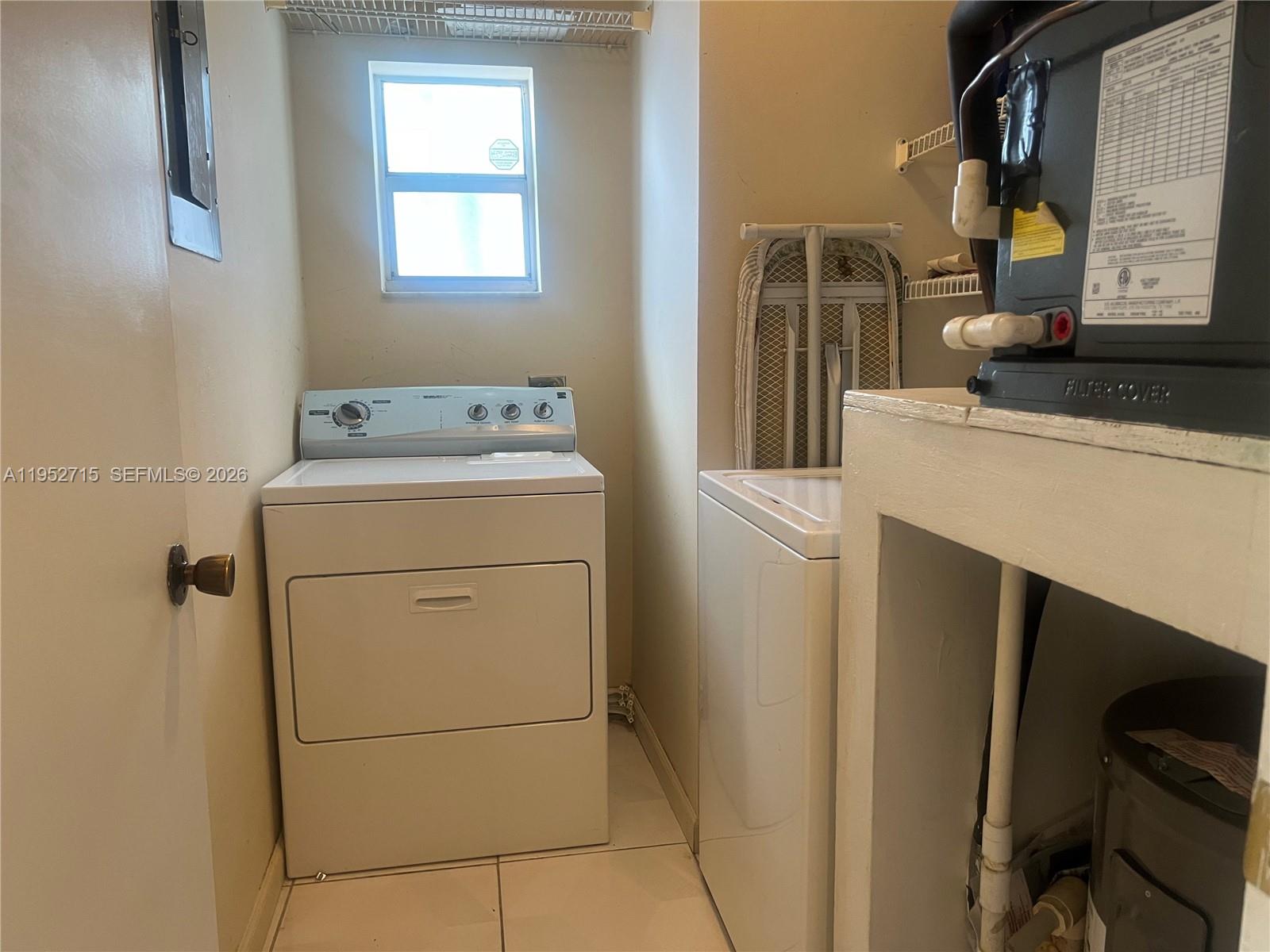 5827 Northwest 197th Terrace Hialeah, FL 33015 - Photo 19 of 30 a utility room with dryer and washer