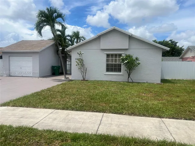 a house view with a garden space