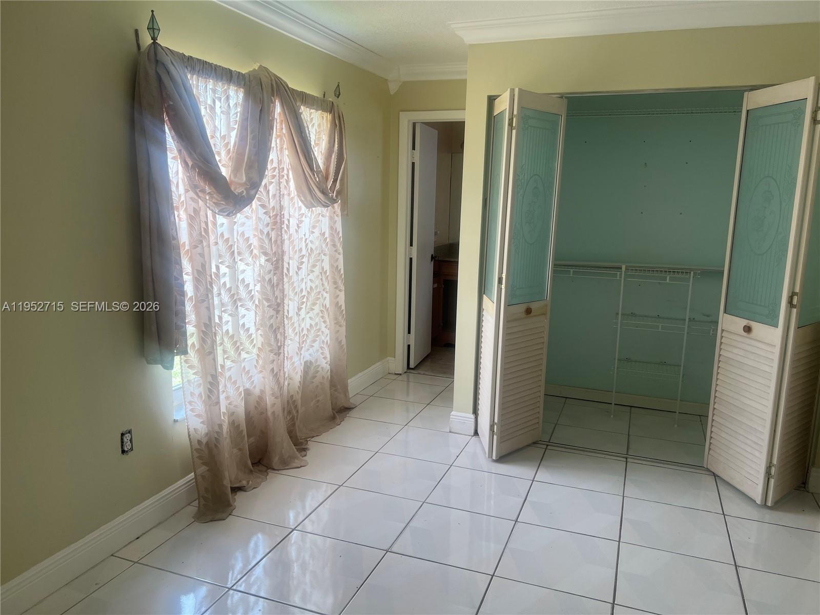 5827 Northwest 197th Terrace Hialeah, FL 33015 - Photo 22 of 30 a view of a bathroom with a shower and a sink
