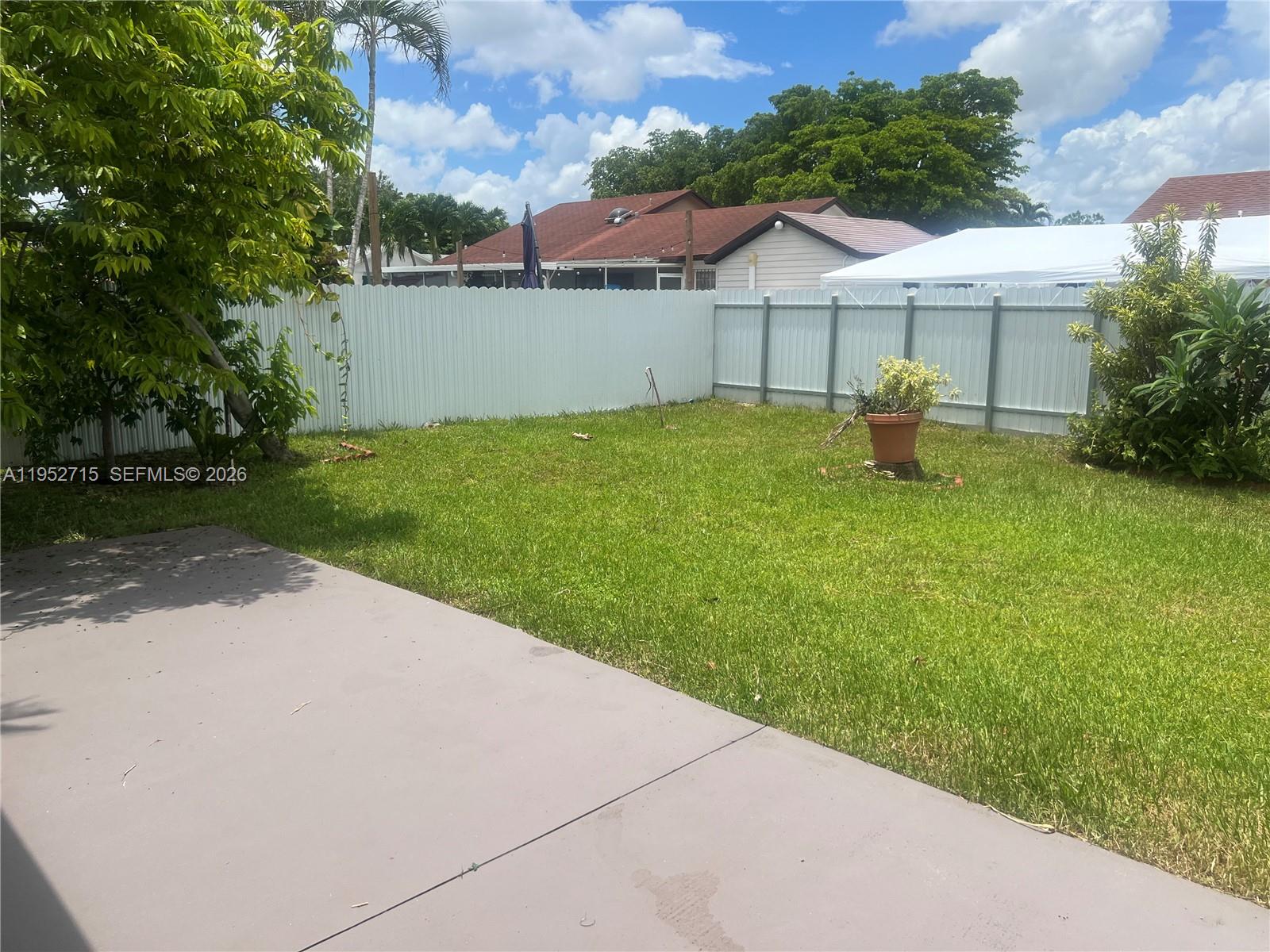 5827 Northwest 197th Terrace Hialeah, FL 33015 - Photo 29 of 30 a view of a house with backyard and garden