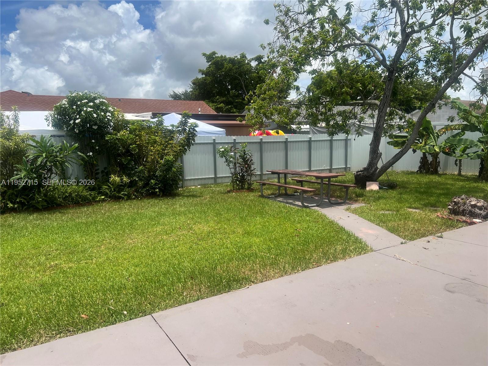 5827 Northwest 197th Terrace Hialeah, FL 33015 - Photo 30 of 30 a view of a backyard with sitting area