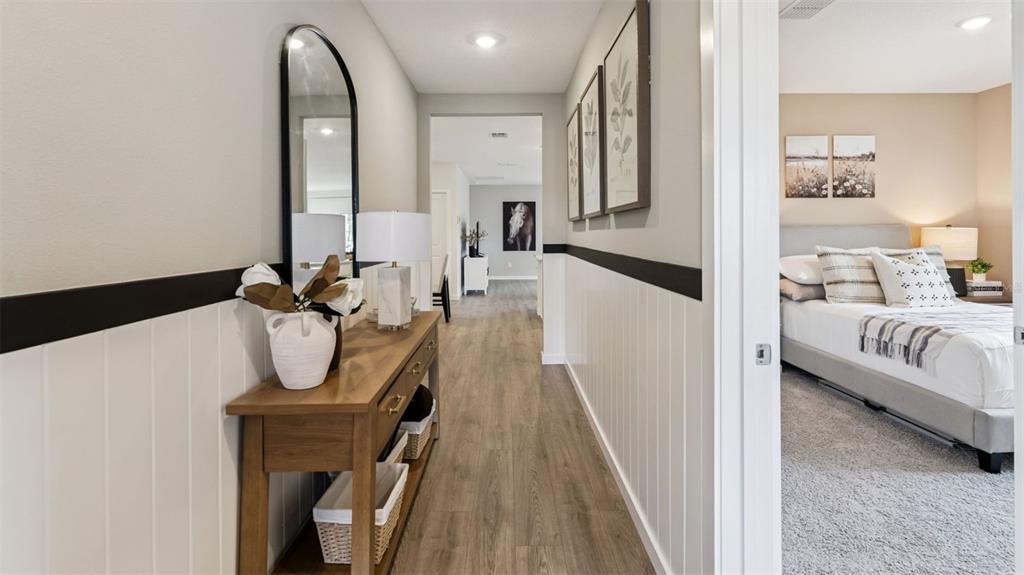 2869 House Finch Road St. Cloud, FL 34773 - Photo 2 of 56 a living room with furniture and a wooden floor