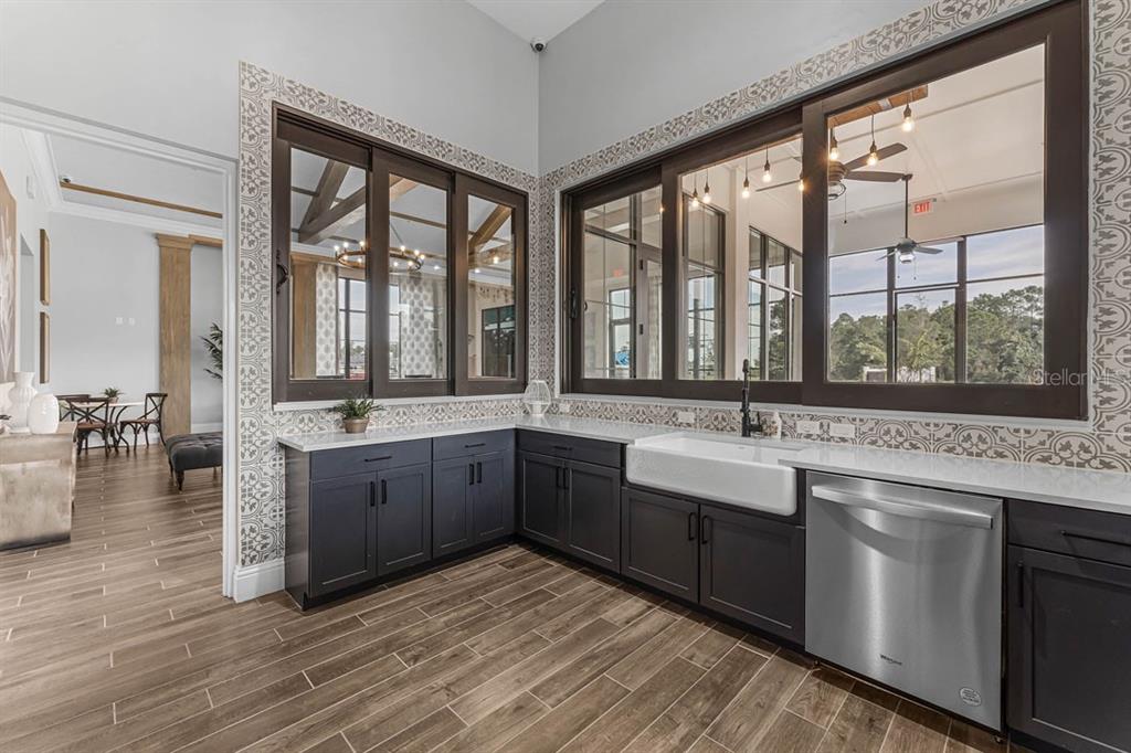 2869 House Finch Road St. Cloud, FL 34773 - Photo 38 of 56 a large kitchen with a large window and a sink