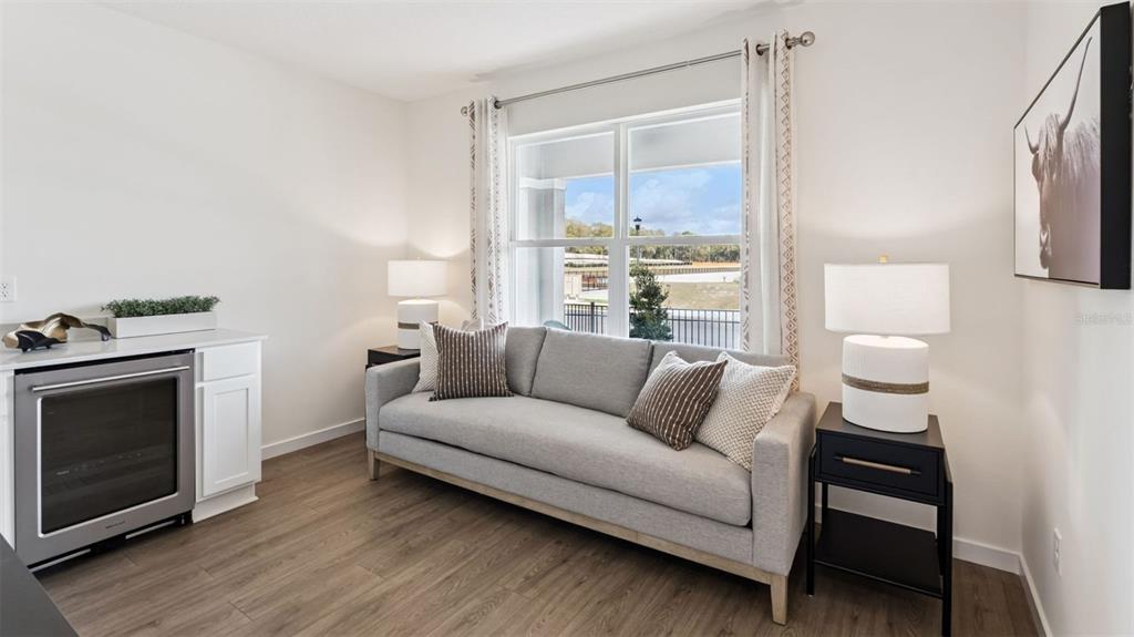 2869 House Finch Road St. Cloud, FL 34773 - Photo 10 of 56 a living room with furniture and a fireplace