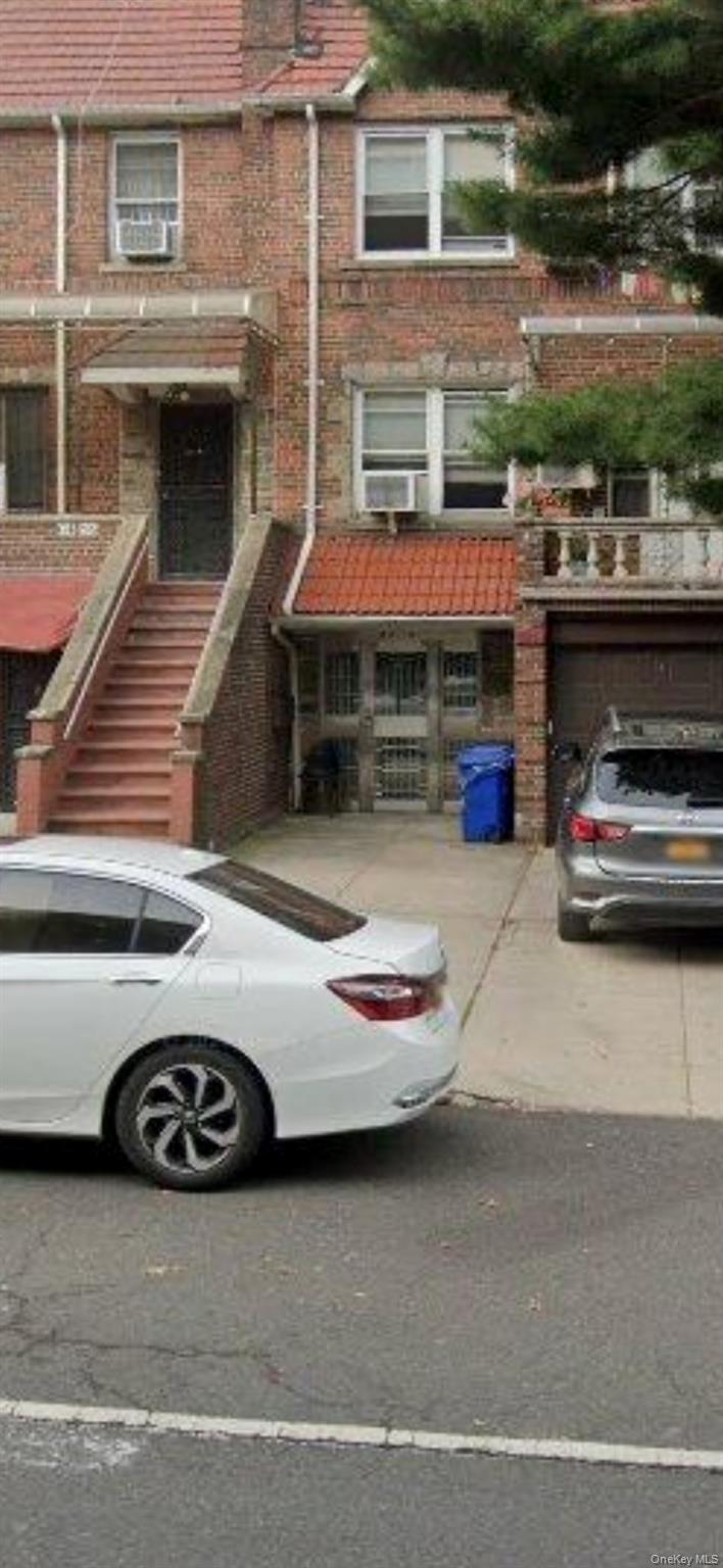 a car parked in front of a house