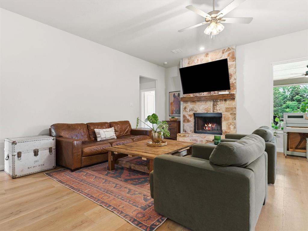 155 Rj Smith Drive Boyd, TX 76023 - Photo 15 of 37 Open-concept living room with abundant natural light, ideal for entertaining and everyday living.