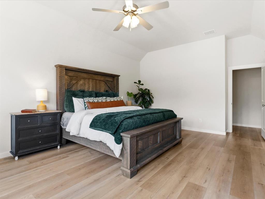 155 Rj Smith Drive Boyd, TX 76023 - Photo 18 of 37 Private primary suite with spacious layout and peaceful views of the surrounding property.