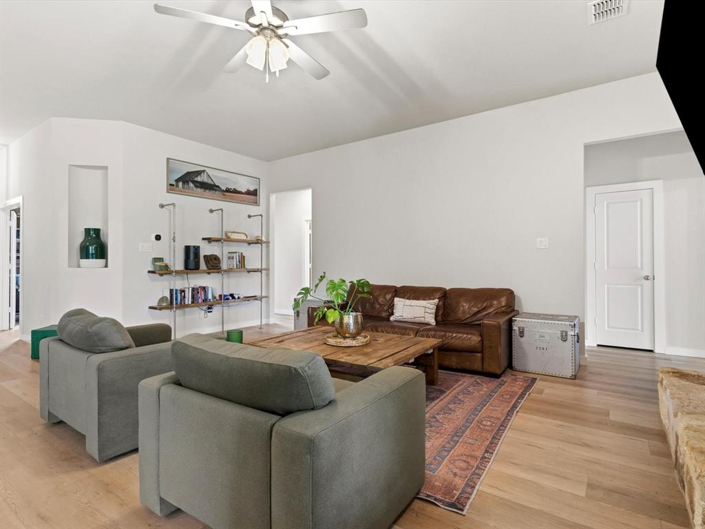 155 Rj Smith Drive Boyd, TX 76023 - Photo 23 of 37 Open-concept living room with abundant natural light, ideal for entertaining and everyday living.