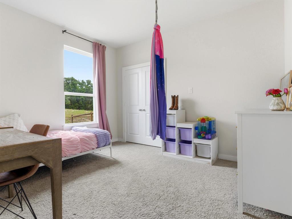 155 Rj Smith Drive Boyd, TX 76023 - Photo 26 of 37 Additional bedroom ideal for guests, family, or flexible use.