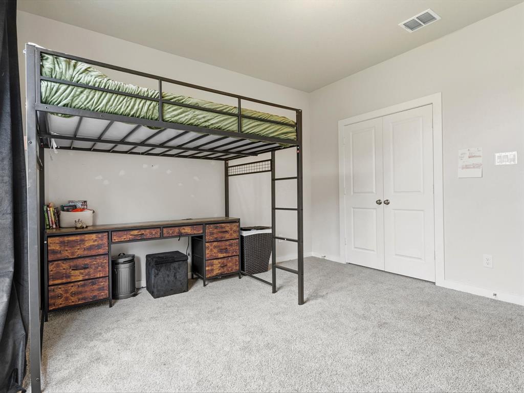 155 Rj Smith Drive Boyd, TX 76023 - Photo 28 of 37 Comfortable secondary bedroom faces the street, with natural light