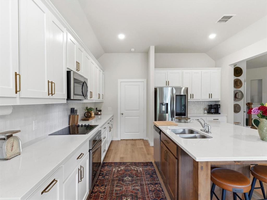 155 Rj Smith Drive Boyd, TX 76023 - Photo 10 of 37 Well-appointed kitchen designed for both everyday use and entertaining with functional layout and storage.