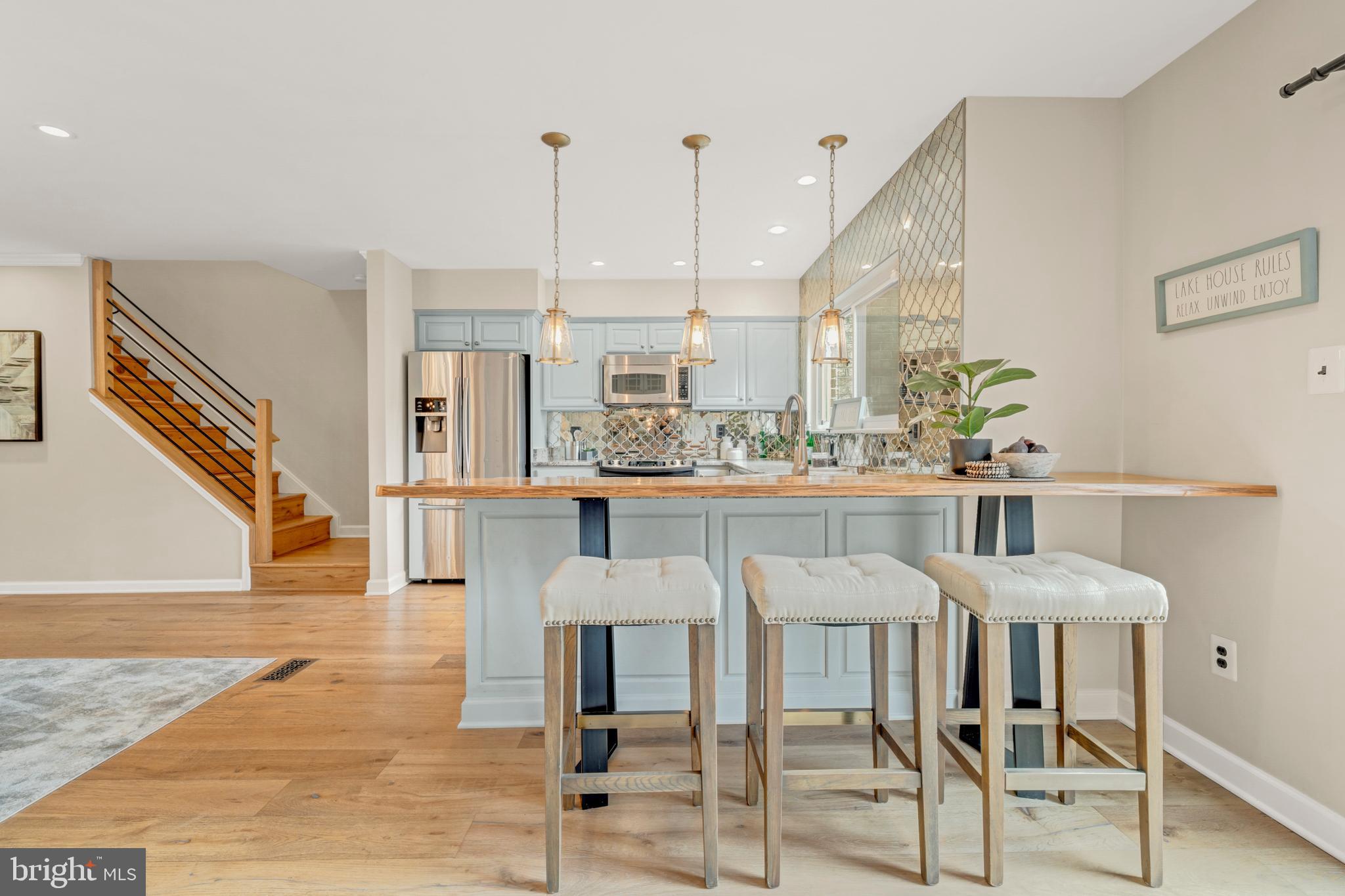 2012 Swans Neck Way Reston, VA 20191 - Photo 13 of 48 a dining room with furniture and wooden floor