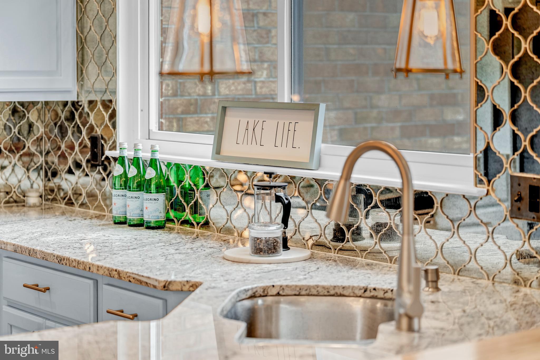 2012 Swans Neck Way Reston, VA 20191 - Photo 16 of 48 a view of a kitchen with granite countertop a sink and a window