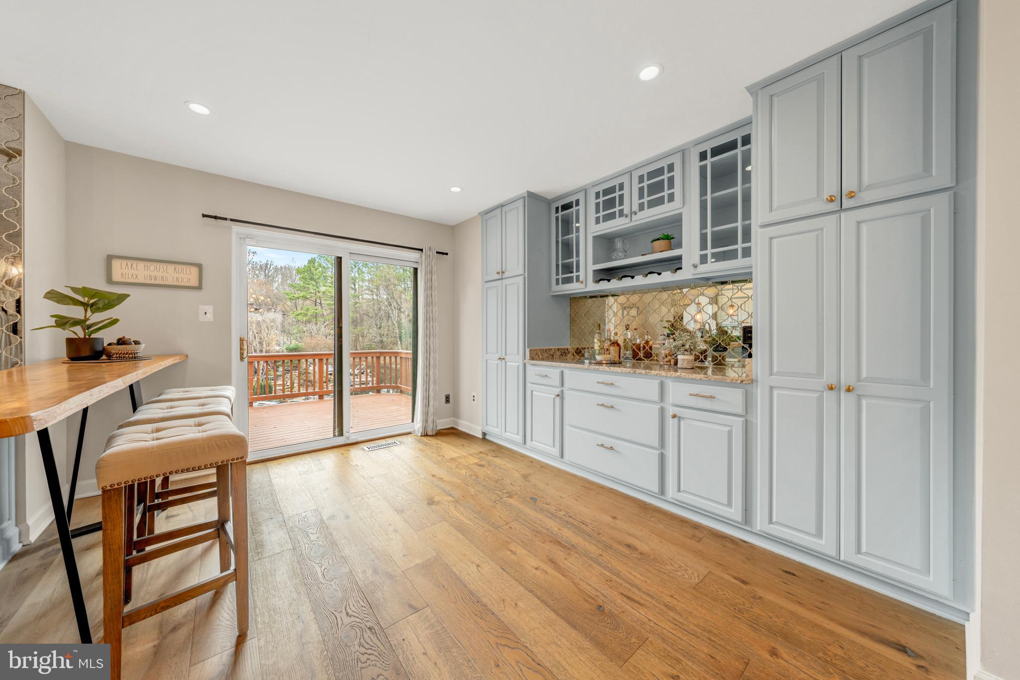 2012 Swans Neck Way Reston, VA 20191 - Photo 19 of 48 a hall with cabinets and wooden floor