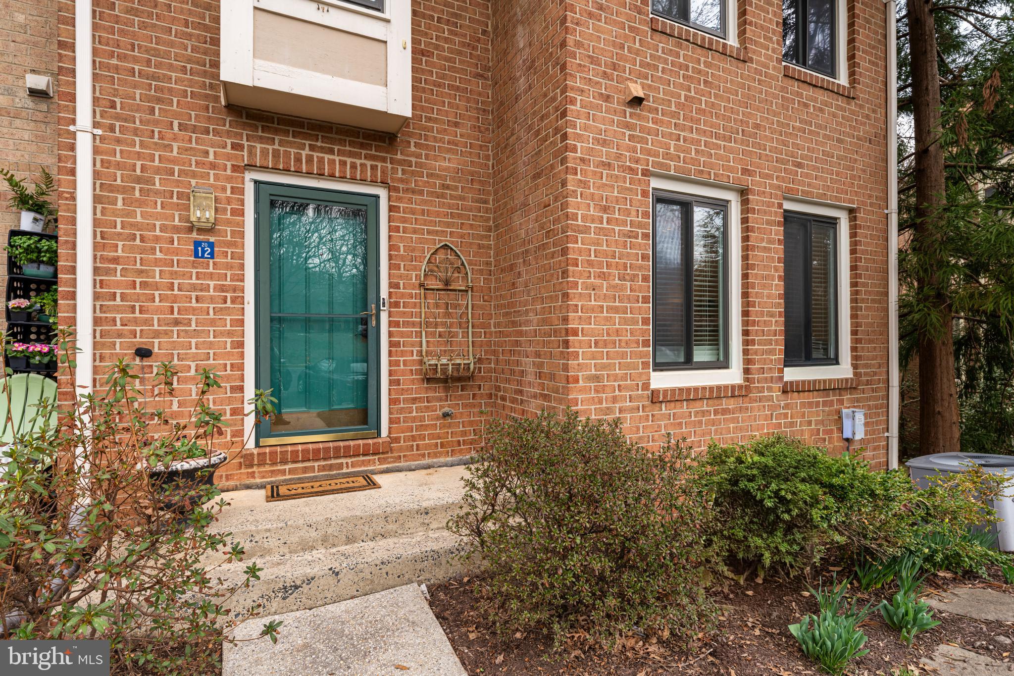 2012 Swans Neck Way Reston, VA 20191 - Photo 2 of 48 a front view of a house with a yard