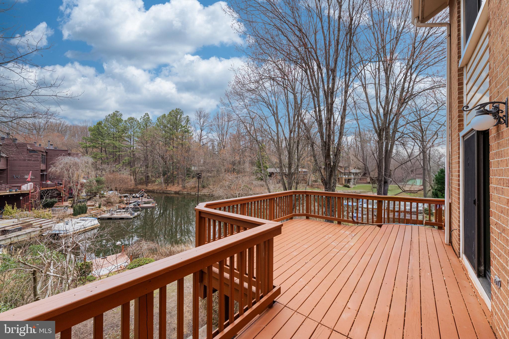 2012 Swans Neck Way Reston, VA 20191 - Photo 21 of 48 a view of balcony with wooden floor and fence