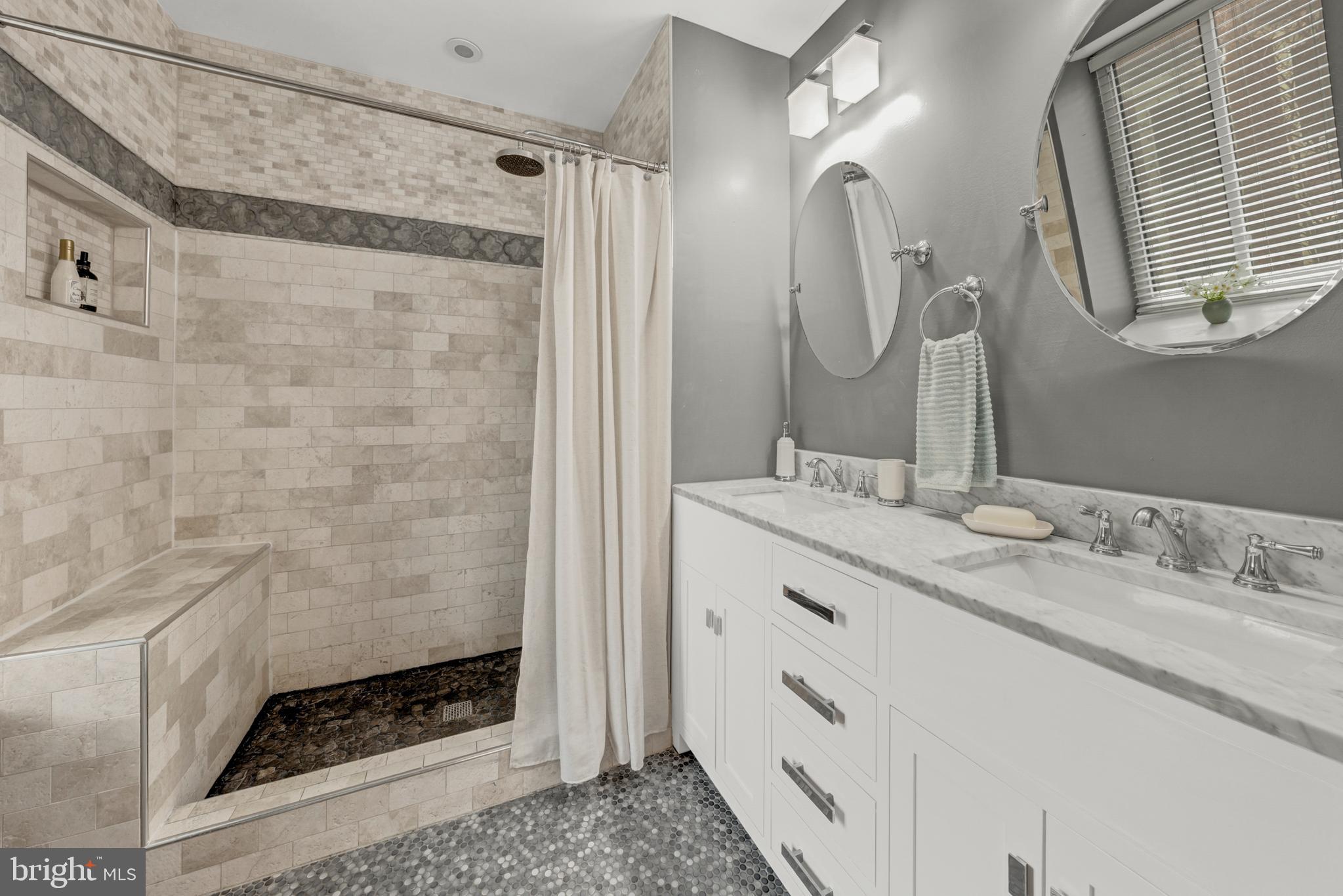 2012 Swans Neck Way Reston, VA 20191 - Photo 26 of 48 a bathroom with a granite countertop shower sink and mirror