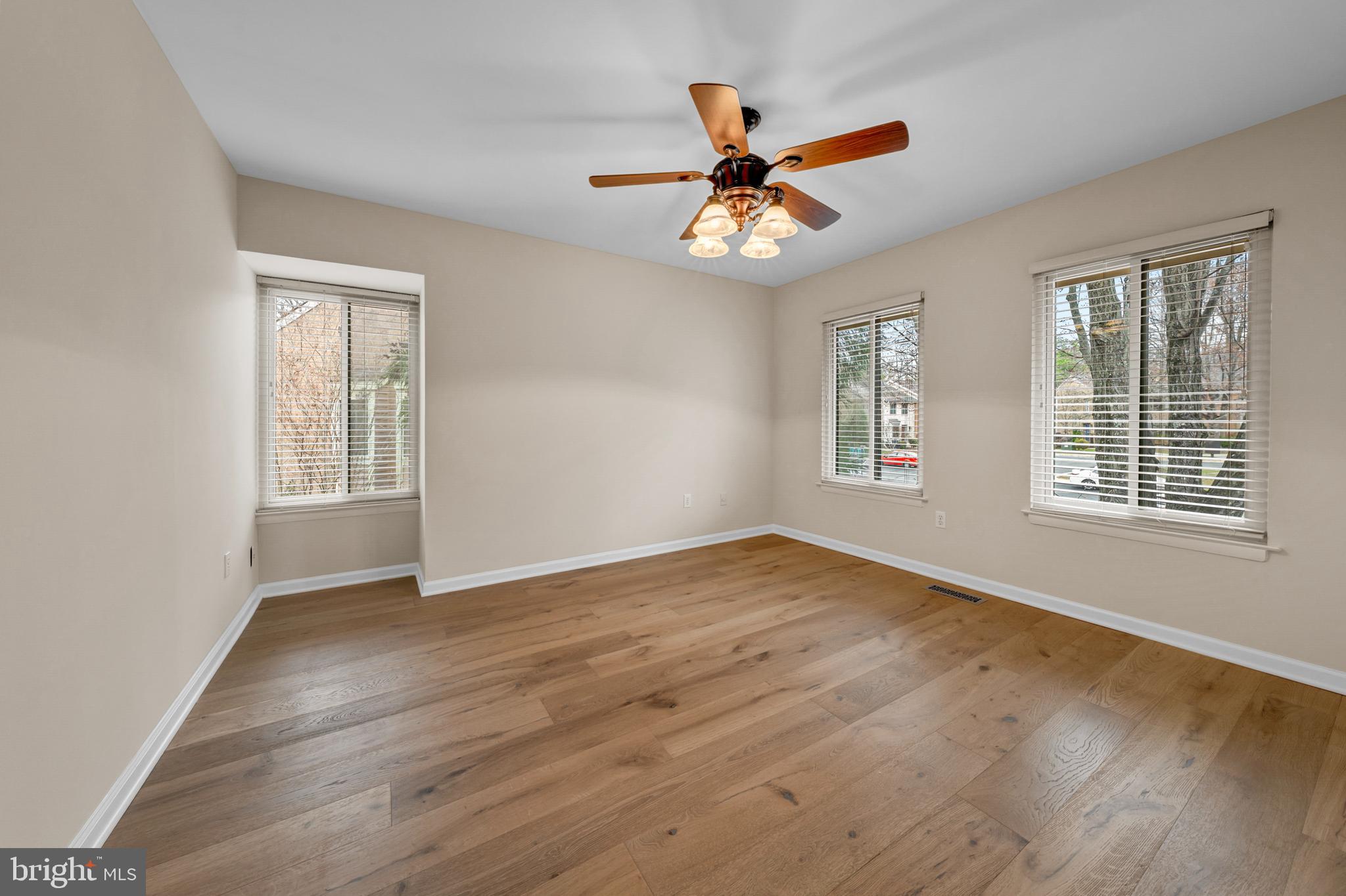 2012 Swans Neck Way Reston, VA 20191 - Photo 27 of 48 a view of an empty room with wooden floor and a window