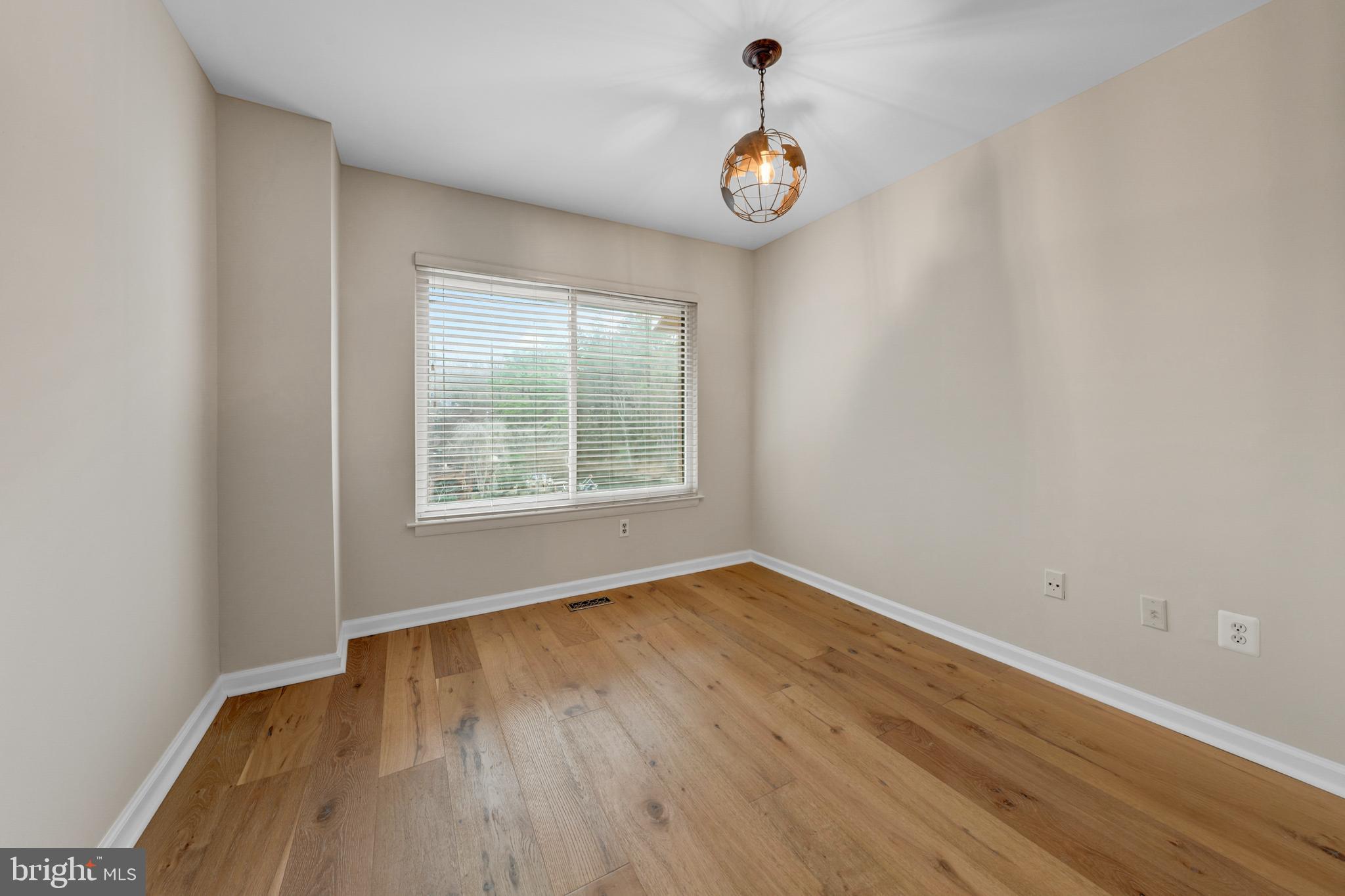2012 Swans Neck Way Reston, VA 20191 - Photo 28 of 48 a view of an empty room with wooden floor and a window