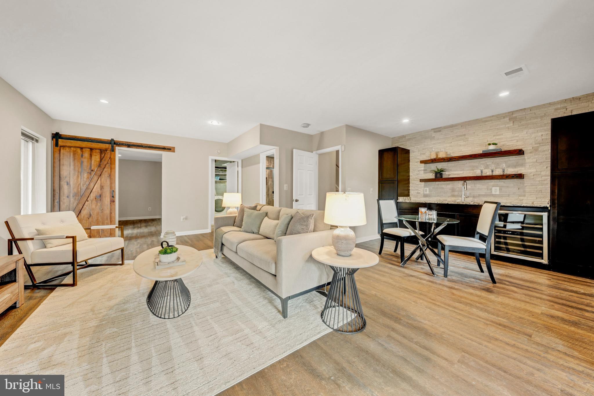 2012 Swans Neck Way Reston, VA 20191 - Photo 30 of 48 a living room with furniture and a wooden floor