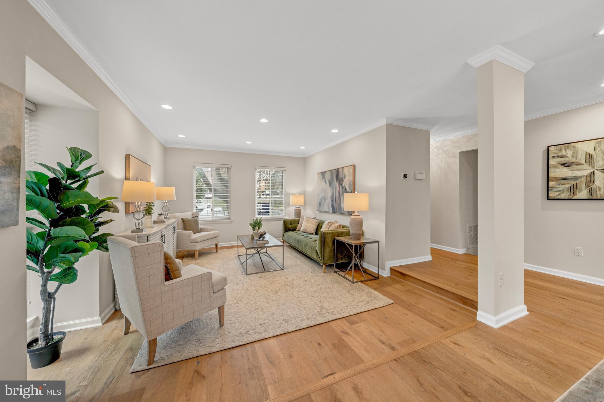 2012 Swans Neck Way Reston, VA 20191 - Photo 3 of 48 a living room with furniture a potted plant and a table