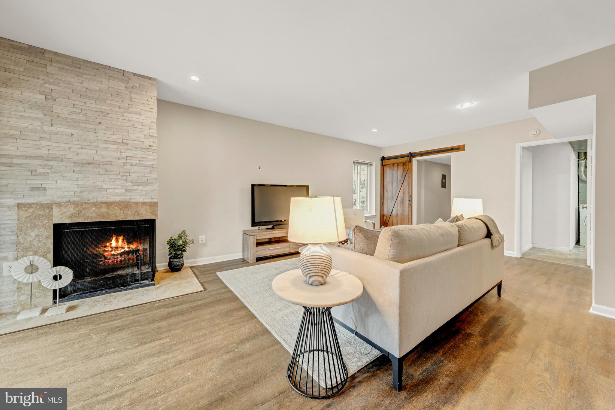 2012 Swans Neck Way Reston, VA 20191 - Photo 32 of 48 a living room with furniture and a fireplace