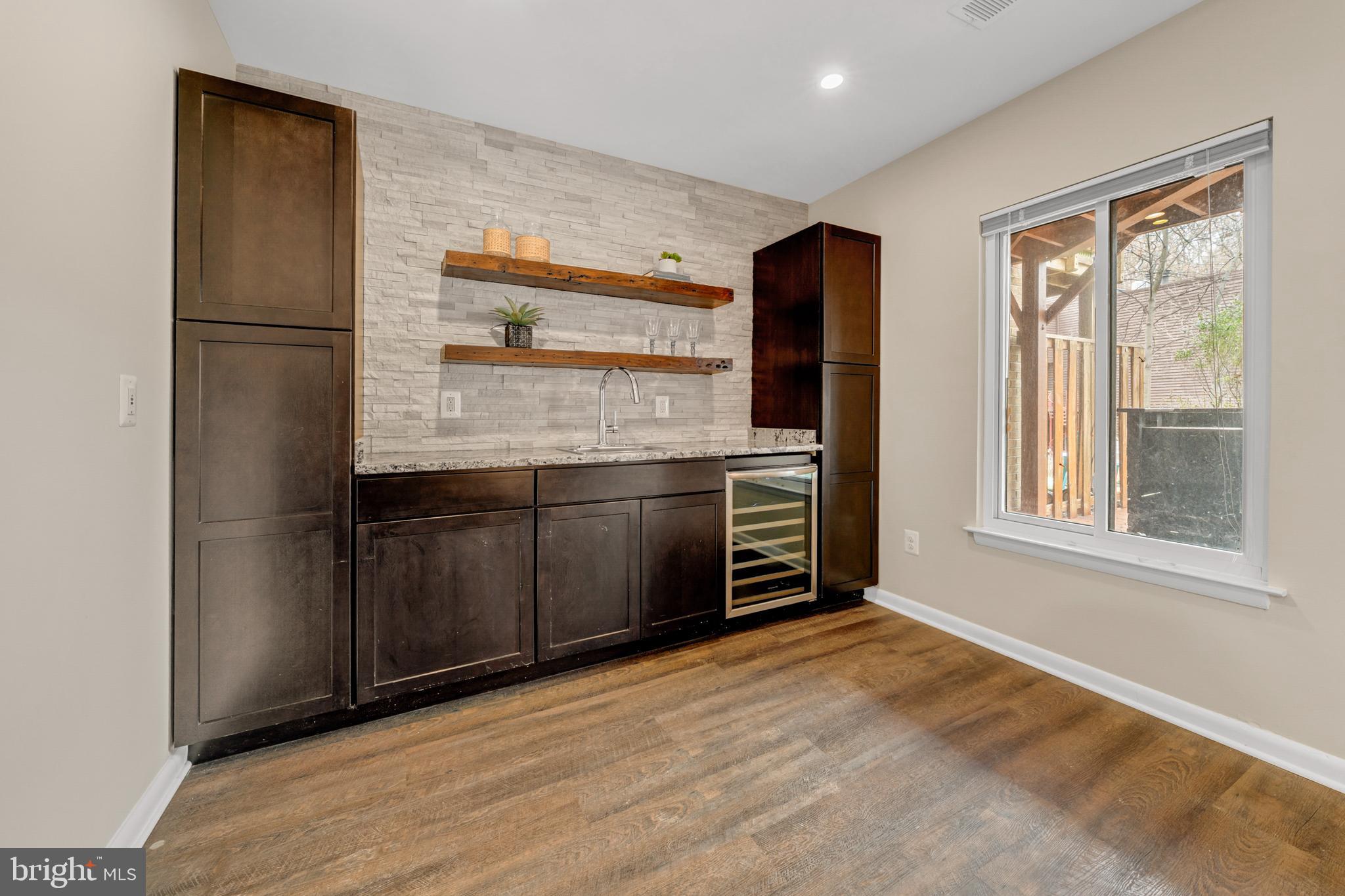 2012 Swans Neck Way Reston, VA 20191 - Photo 34 of 48 a kitchen with stainless steel appliances granite countertop a refrigerator and a sink