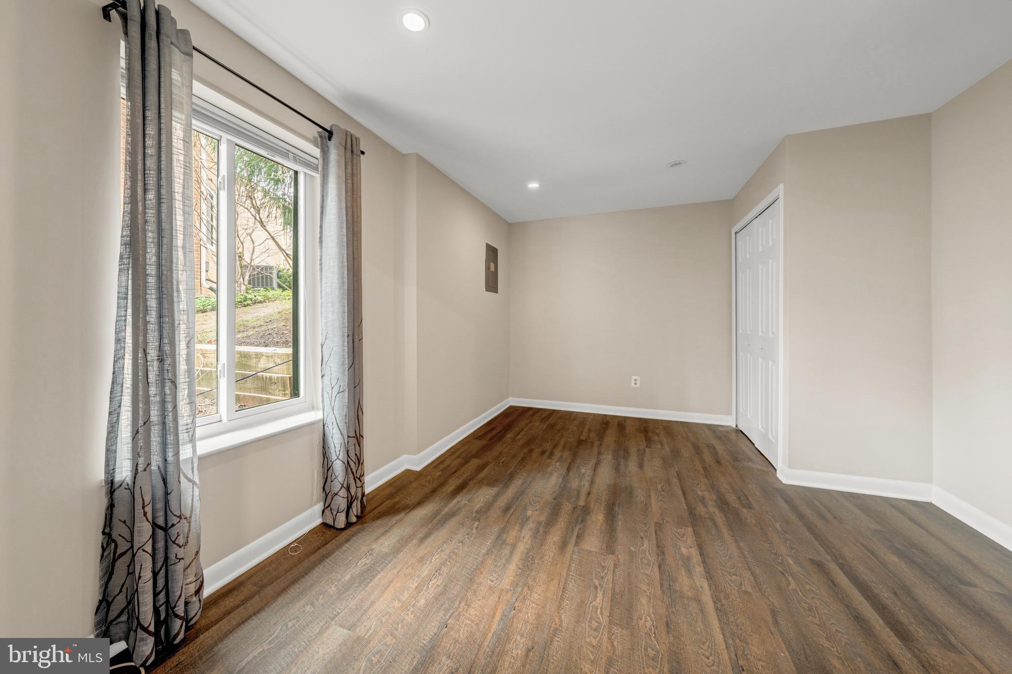 2012 Swans Neck Way Reston, VA 20191 - Photo 35 of 48 a view of an empty room with wooden floor and a window