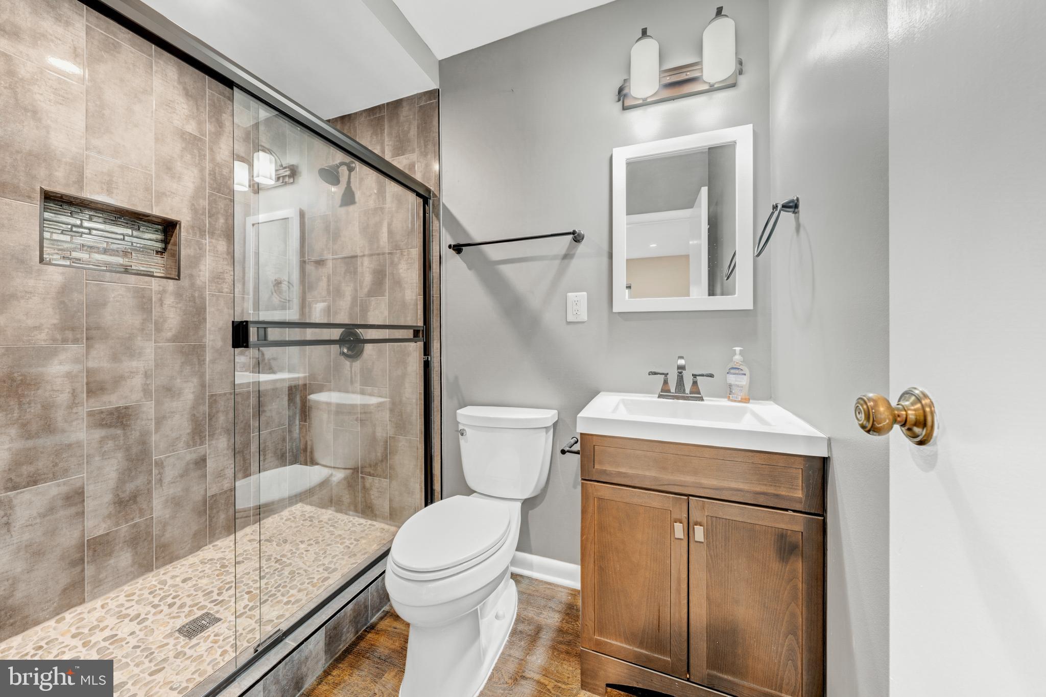 2012 Swans Neck Way Reston, VA 20191 - Photo 36 of 48 a bathroom with a sink a toilet and shower