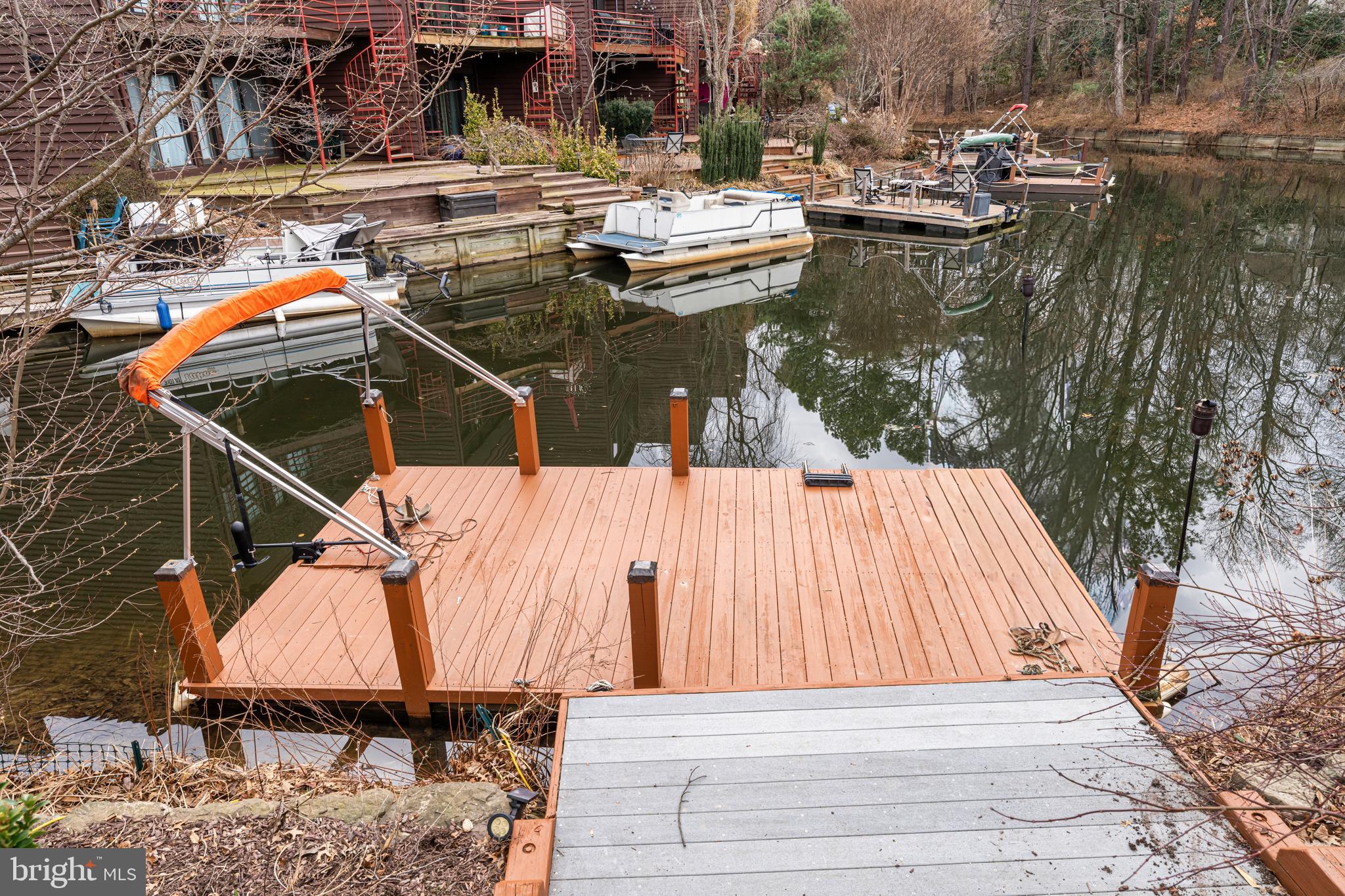 2012 Swans Neck Way Reston, VA 20191 - Photo 40 of 48 a view of a lake with a table and chairs