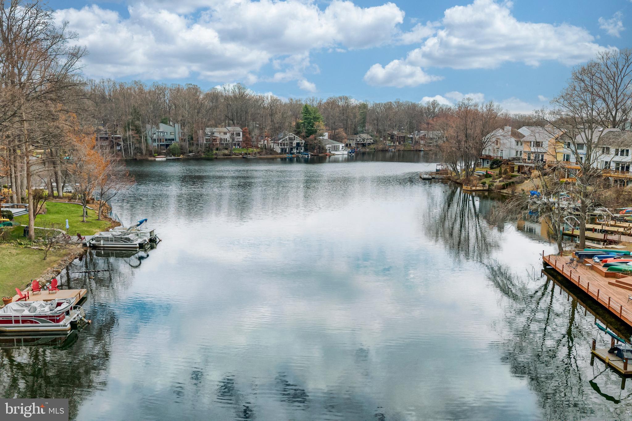 2012 Swans Neck Way Reston, VA 20191 - Photo 42 of 48 a view of a lake with a table and chairs