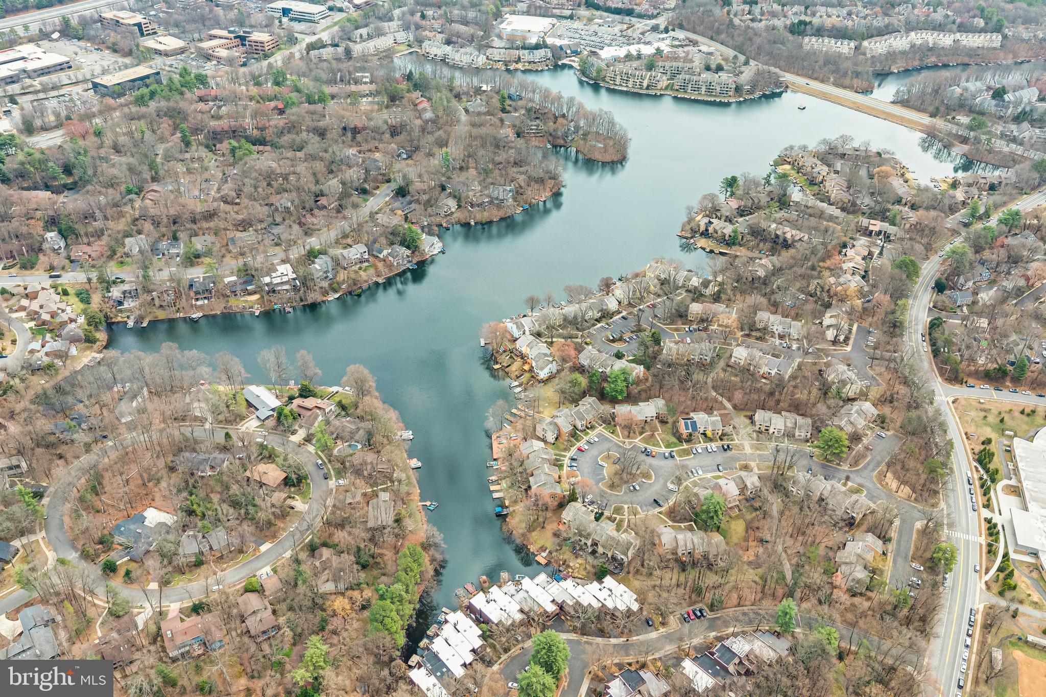 2012 Swans Neck Way Reston, VA 20191 - Photo 44 of 48 an aerial view of a house with a lake view