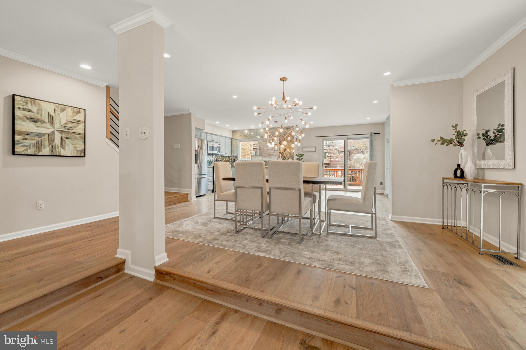 2012 Swans Neck Way Reston, VA 20191 - Photo 8 of 48 a living room with furniture and a chandelier