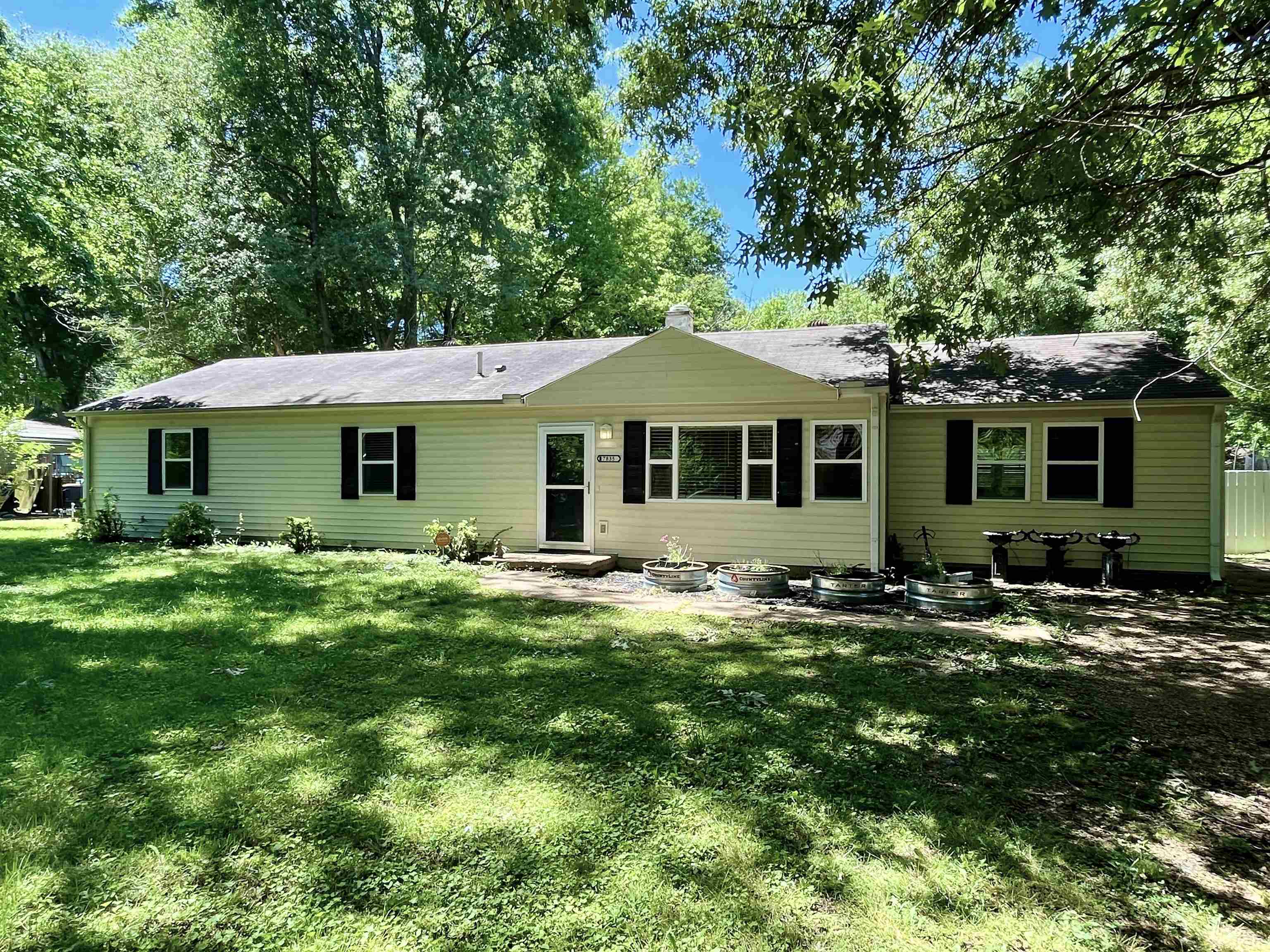 7835 Captain Road Millington, TN 38053 - Photo 1 of 24 a front view of a house with a garden