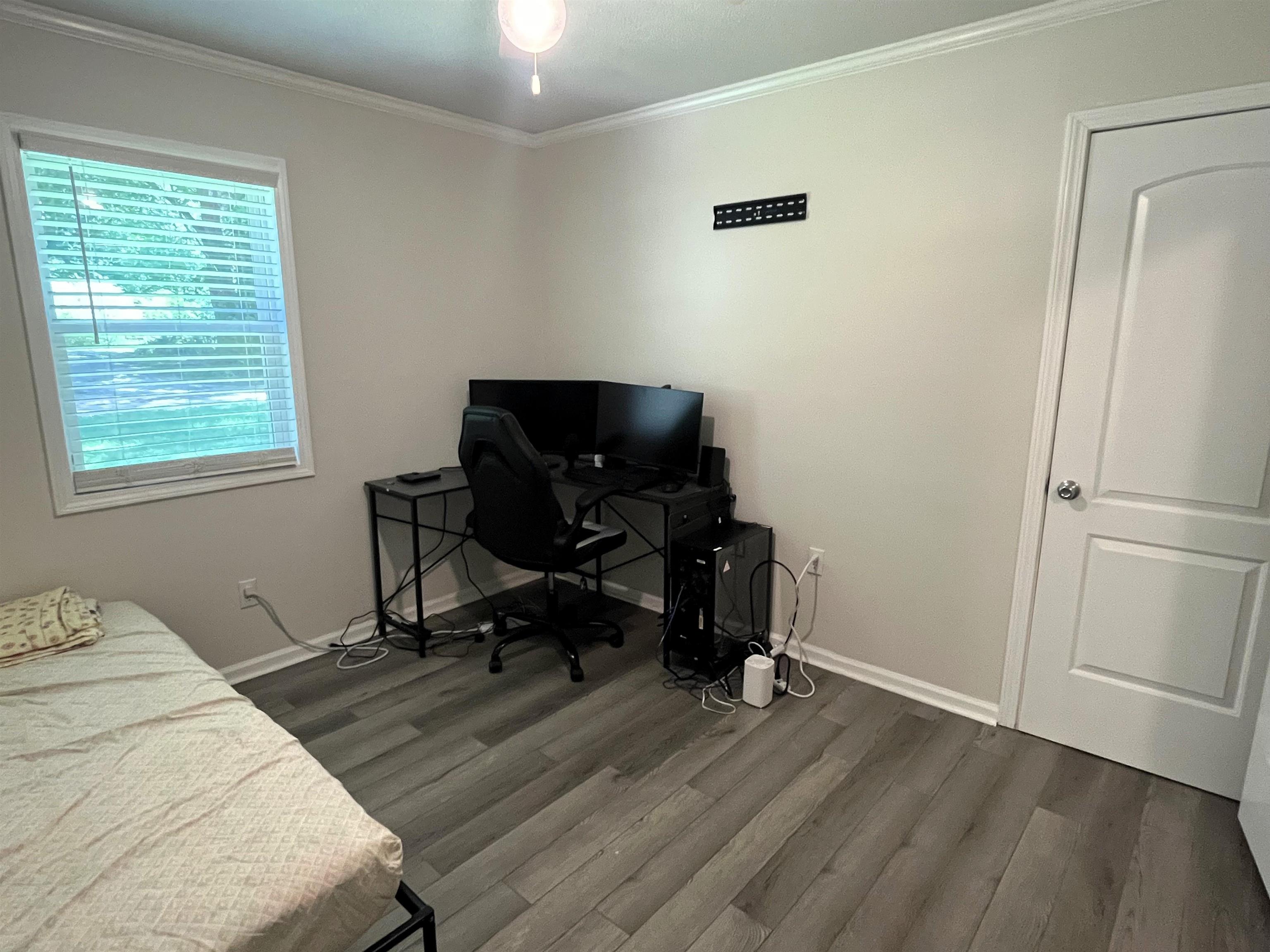 7835 Captain Road Millington, TN 38053 - Photo 17 of 24 a view of a workspace with furniture and a window