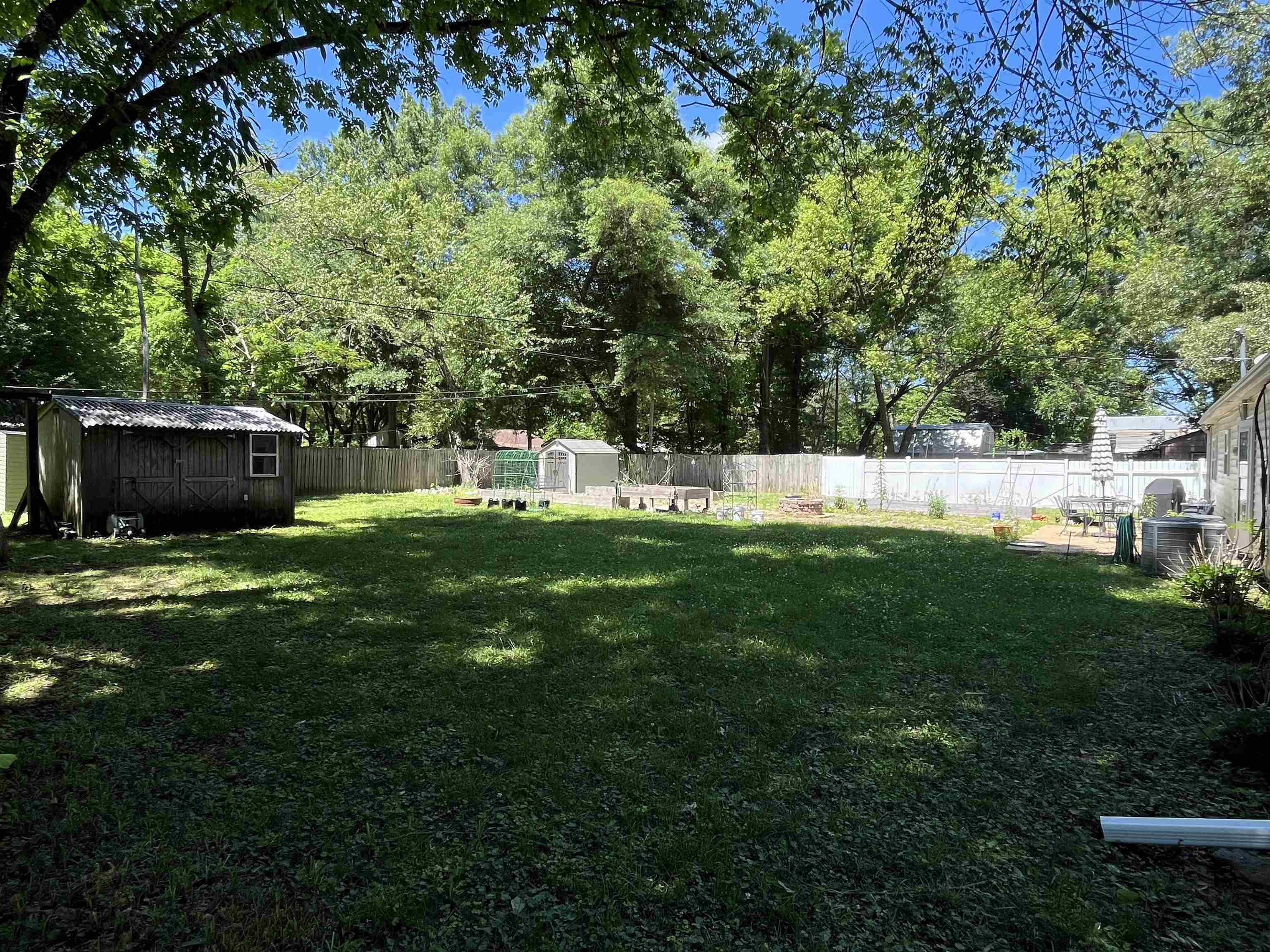 7835 Captain Road Millington, TN 38053 - Photo 21 of 24 a view of a house with a backyard and a garden