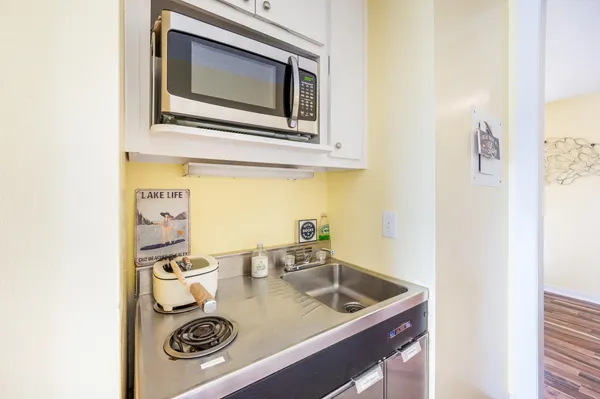 a kitchen with a stove and a microwave