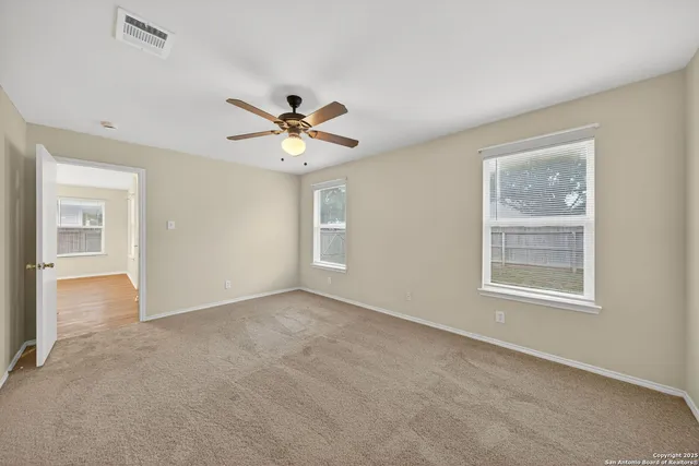 a bathroom with a tub a sink and a mirror
