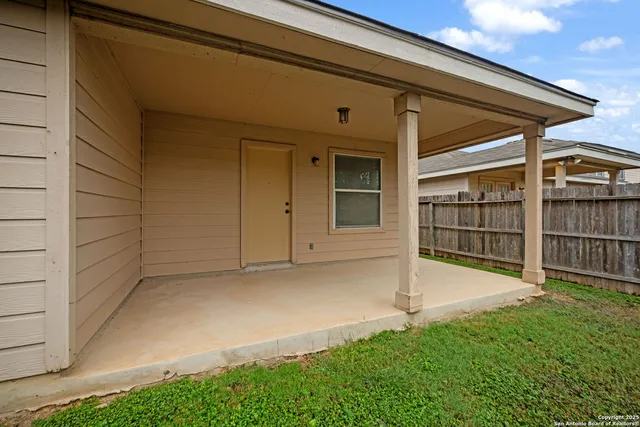 a view of backyard with green space