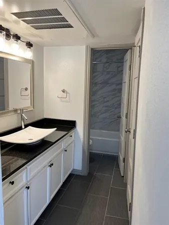 a room with window and ceiling fan