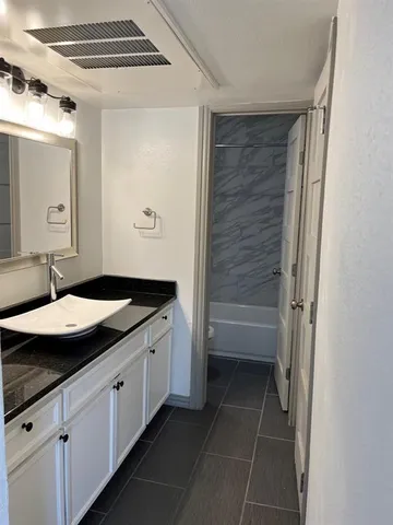 a room with window and ceiling fan