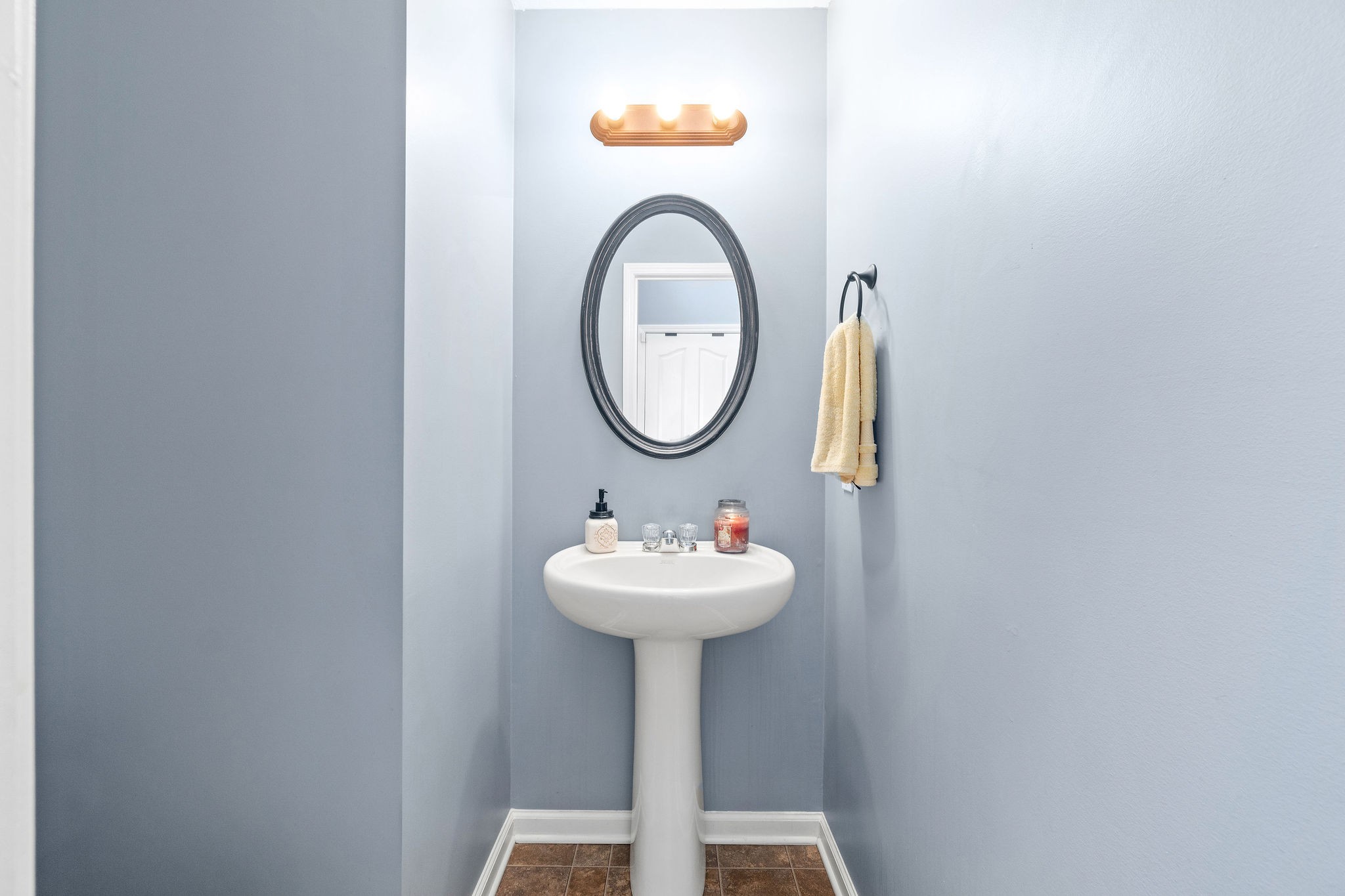 3743 Suiter Road Clarksville, TN 37040 - Photo 11 of 32 a bathroom with a sink and a mirror