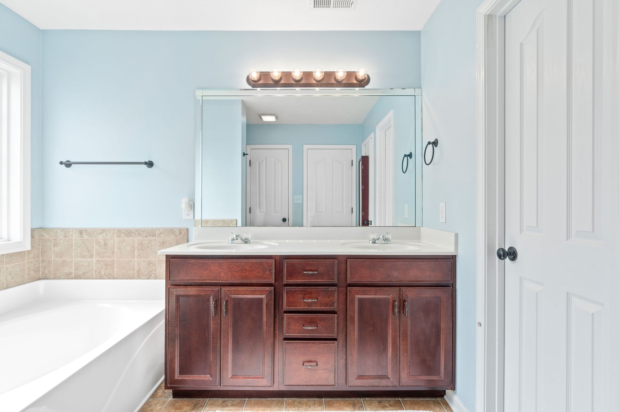 3743 Suiter Road Clarksville, TN 37040 - Photo 20 of 32 a bathroom with a sink and a mirror