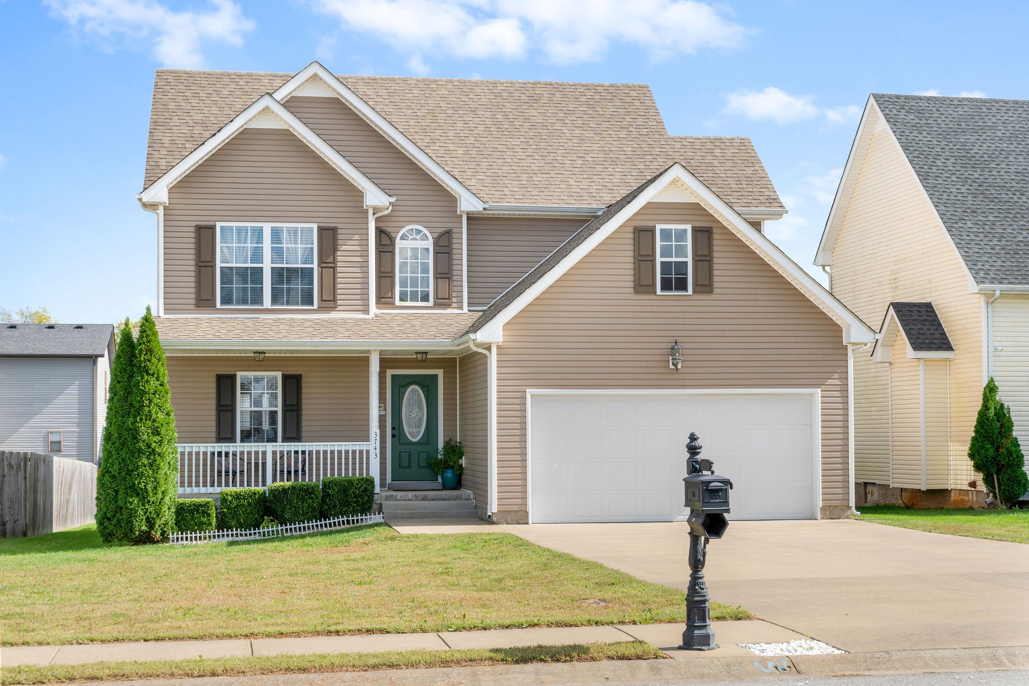 3743 Suiter Road Clarksville, TN 37040 - Photo 3 of 32 a front view of a house with garden