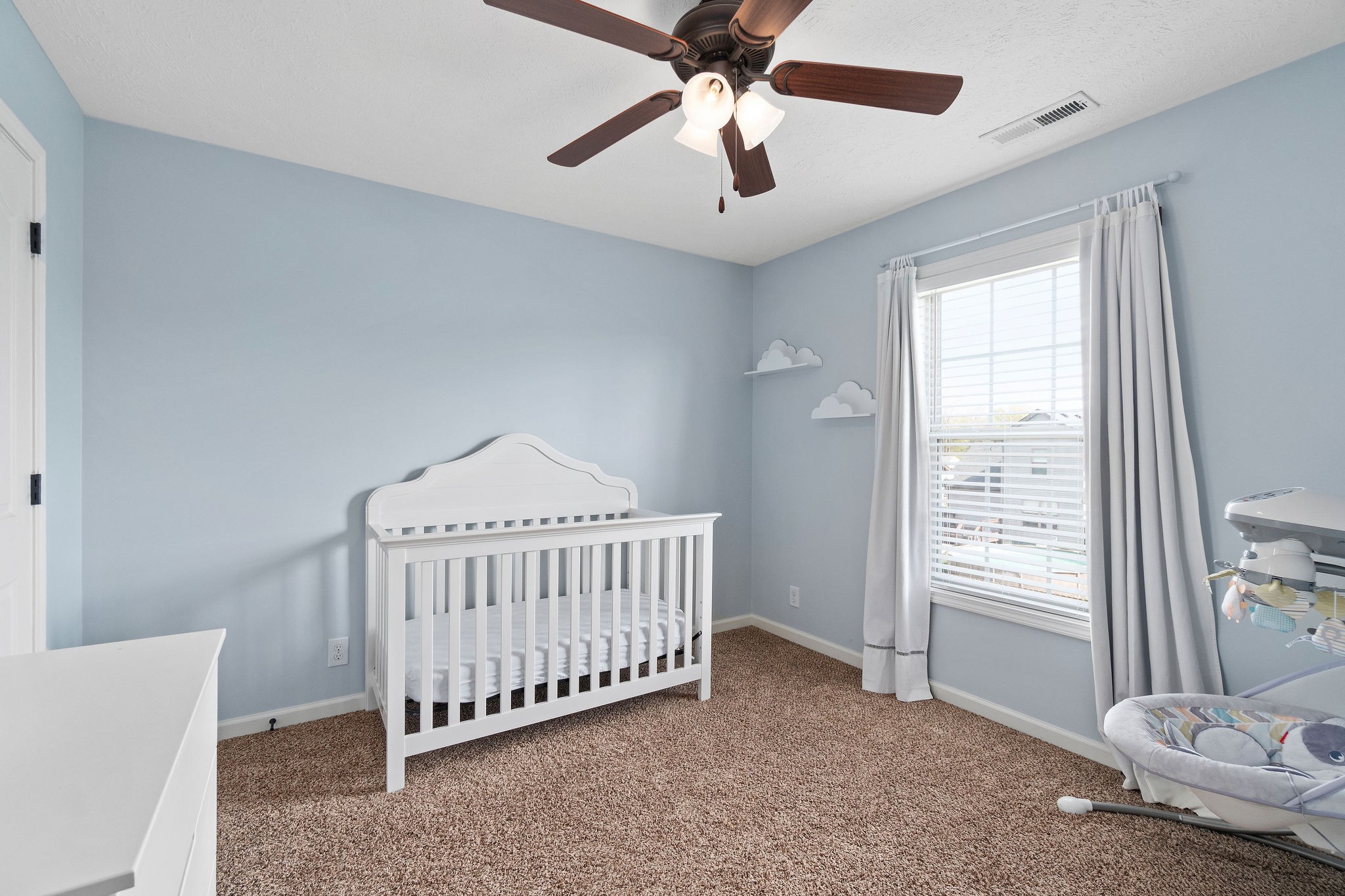 3743 Suiter Road Clarksville, TN 37040 - Photo 23 of 32 a bedroom with a bed and a chandelier fan